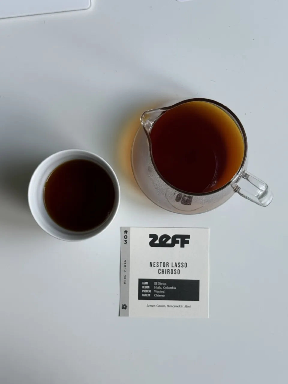 A ZEFF coffee — cup and pitcher with its feature card